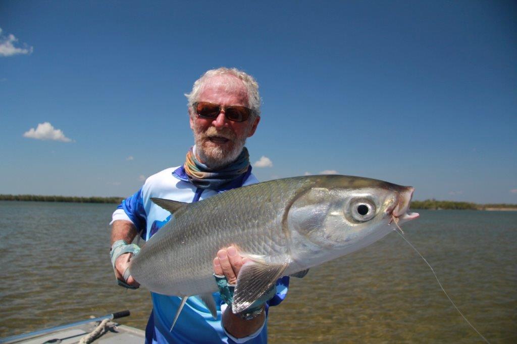 A big milkfish with the successful fly clearly visible.